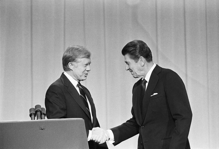 Jimmy Carter and Ronald Reagan shaking hands