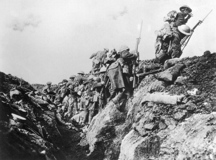 Black and white. Soldiers going over the top of a trench. 