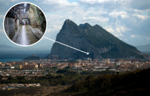 View of the Rock of Gibraltar + People walking down a tunnel beneath the Rock of Gibraltar