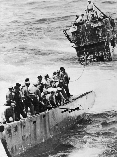 US Navy sailors approaching the sinking U-505 on a boat