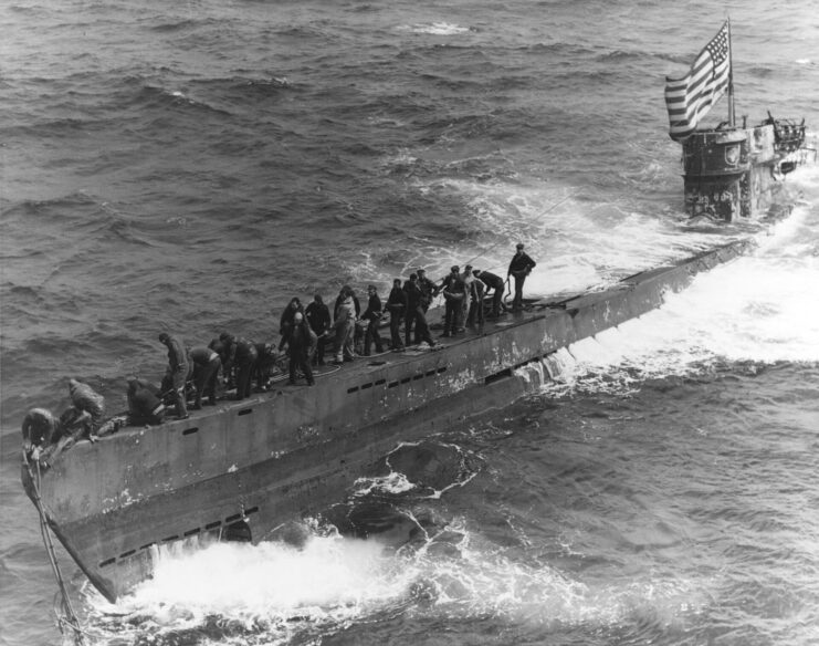 Boarding party standing aboard U-505 at sea