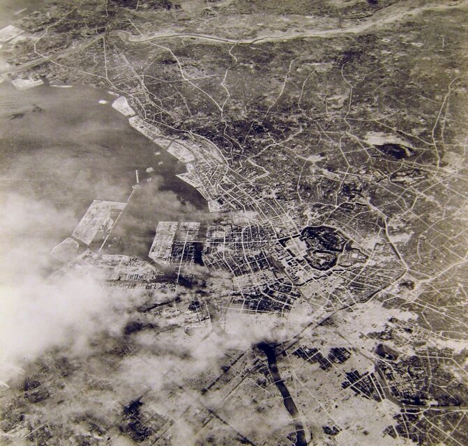 Aerial view of Tokyo, Japan, after the firebombing of the city, with smoke rising in several places