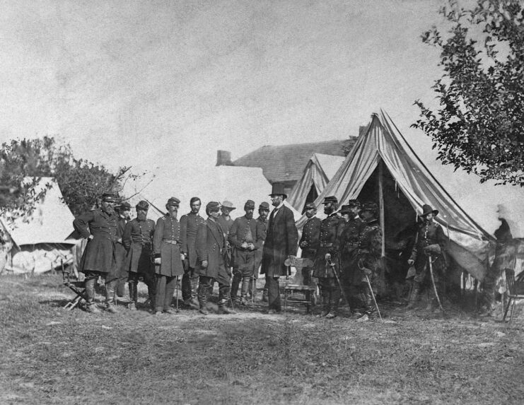 Abraham Lincoln meeting with military personnel at a battlefield camp