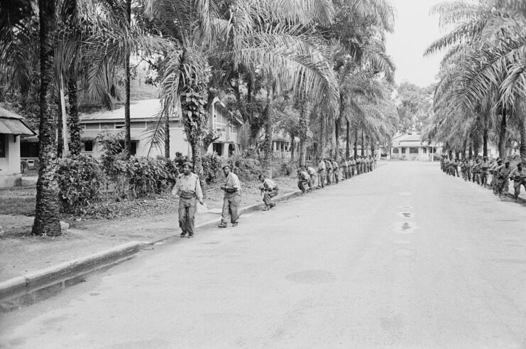 Congolese soldiers walking along a street