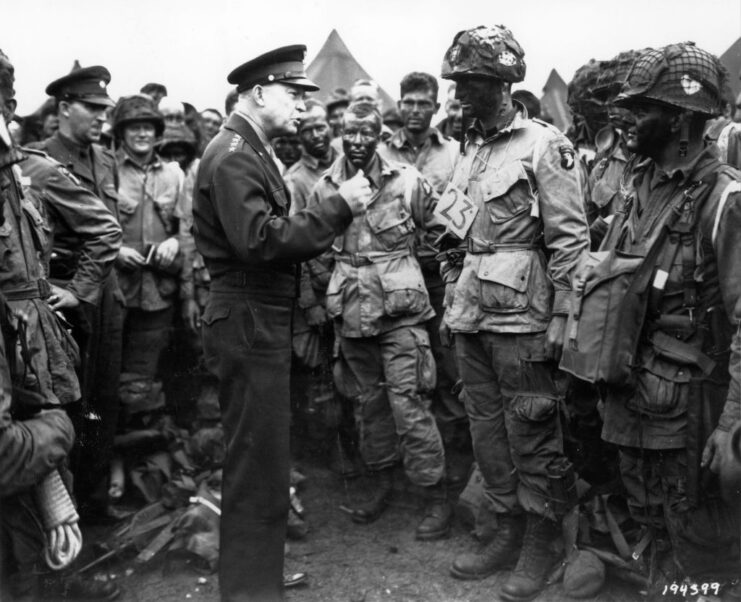 Paratroopers with the 101st Airborne Division standing around Dwight D. Eisenhower