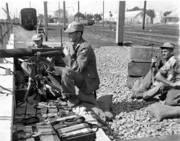 Irish troops manning a machine gun from behind a wall