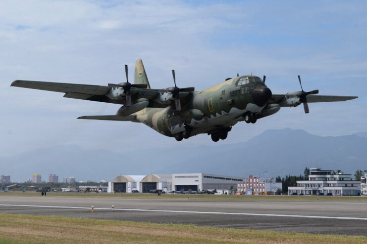 Lockheed C-130 Hercules taking off down a runway