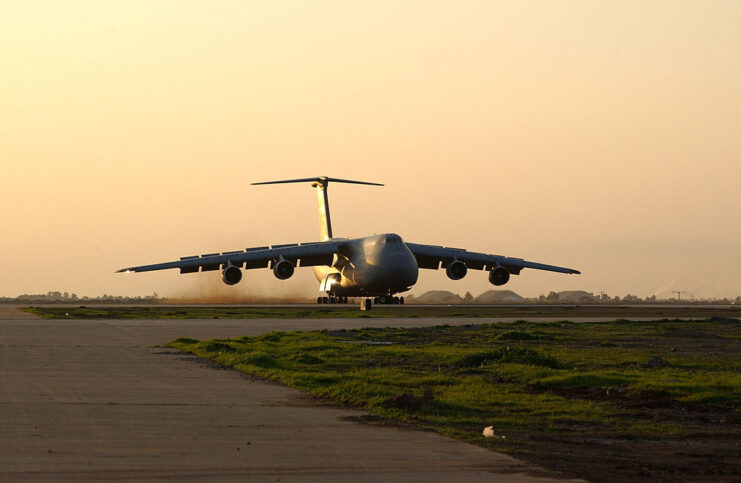 Lockheed C-5 Galaxy parked on a runway at sunset