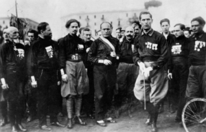 Benito Mussolini standing with members of the National Fascist Party (PNF)