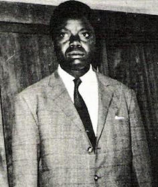 Moïse Tshombe standing in a suit