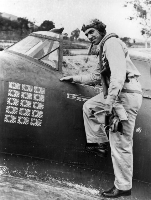 Col. Neel E. Kearby with his Republic P-47 Thunderbolt. Black and white. 