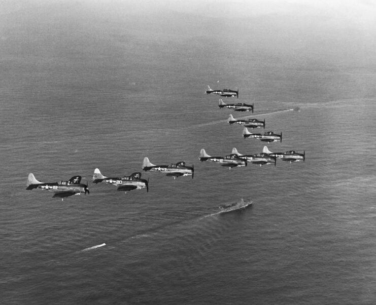 View of SBD Dive Bombers Flying Above an Carrier.