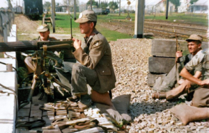 Irish troops manning a machine gun from behind a wall