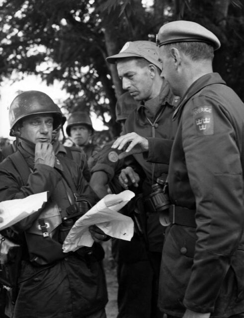 Three Swedish soldiers standing together