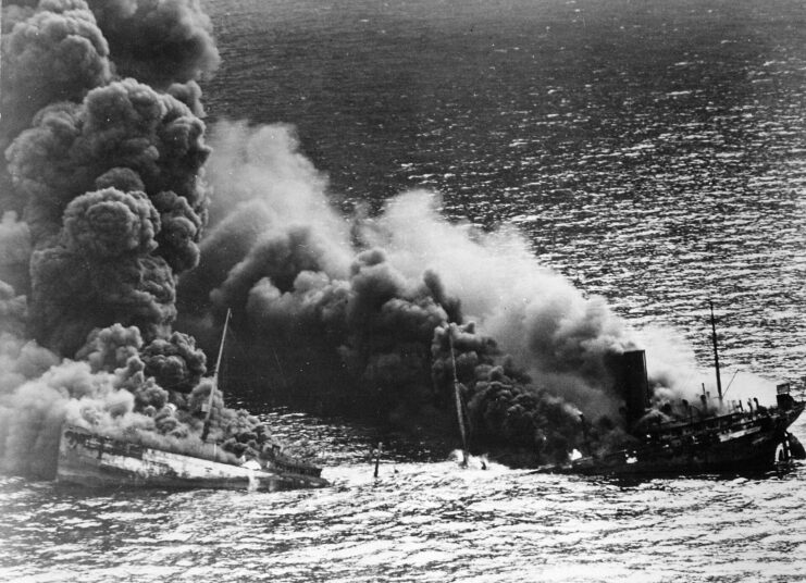 SS Dixie Arrow shrouded in smoke at sea