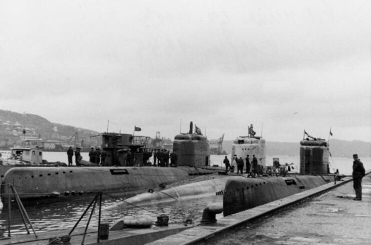 Three Type XXI U-boats and one Type VII U-boat moored at port 