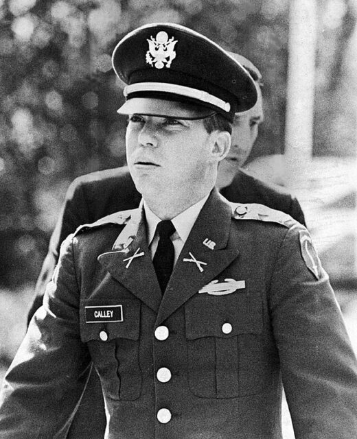 William Calley walking in his US Army uniform