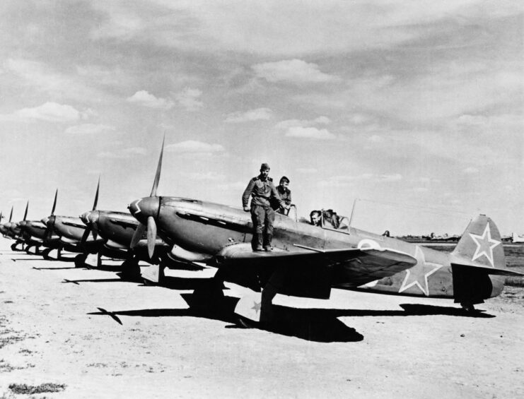 Yakovlev Yak-9s lined up on a runway