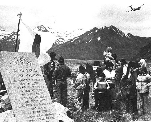 Crowd gathered near a memorial dedicated to those who fought in the Aleutian Islands Campaign