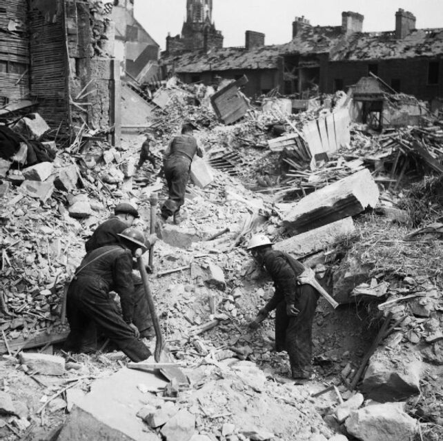 Rescue workers digging through rubble