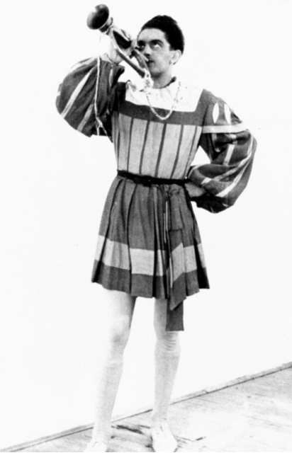 Emmanuel von König standing in costume, holding a trumpet to his mouth