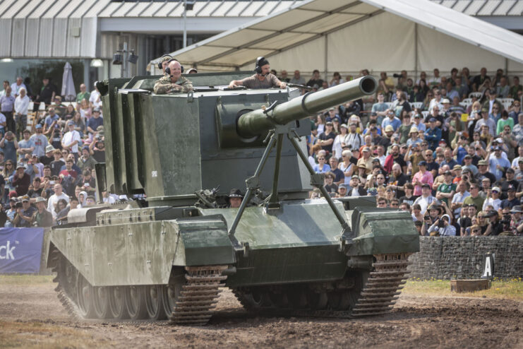 Spectators watching the FV4005 drive around a dirt track