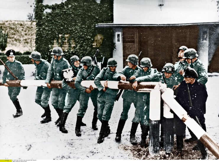 German soldiers pulling a border barrier