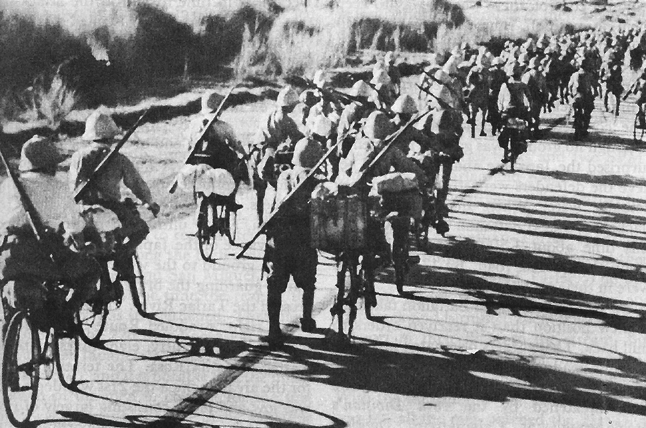 Japanese bicycle troops cycling down a road