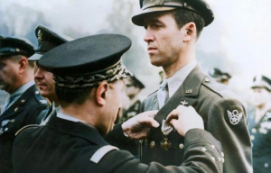 General Martial Henri Valin pinning the Croix de Guerre with palm to James "Jimmy" Stewart's chest