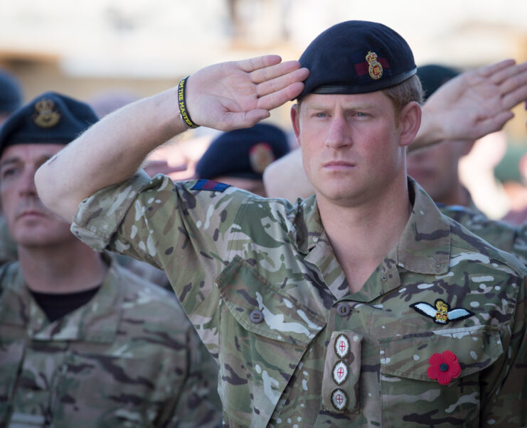 Prince Harry saluting in his military uniform. 