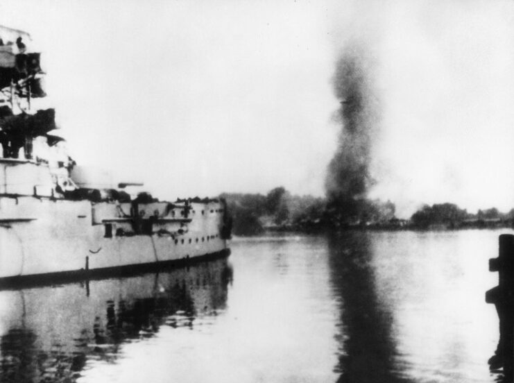 SMS Schleswig-Holstein firing her naval guns at the shore of Westerplatte