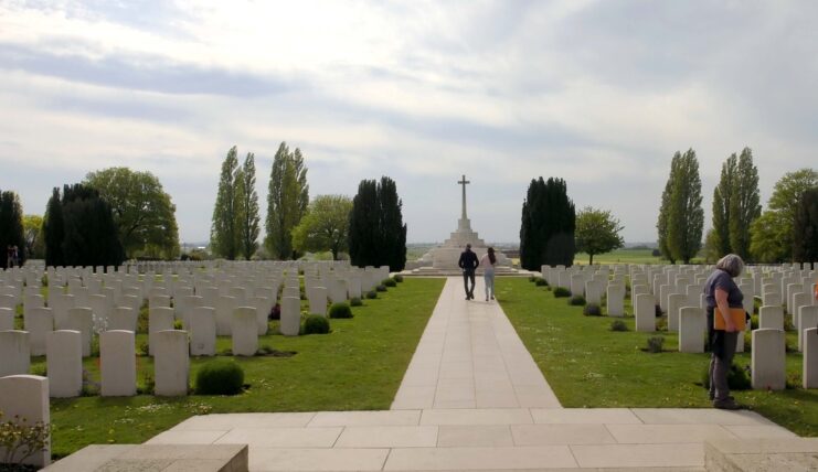 Visitors walking through Tyne Cot Cemetery