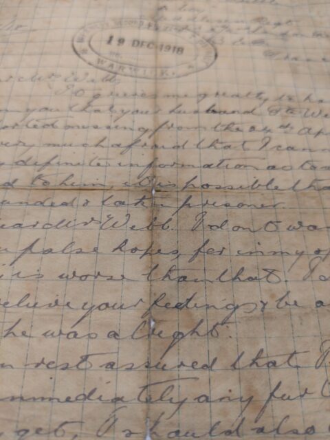 Close-up of a letter written on graph paper