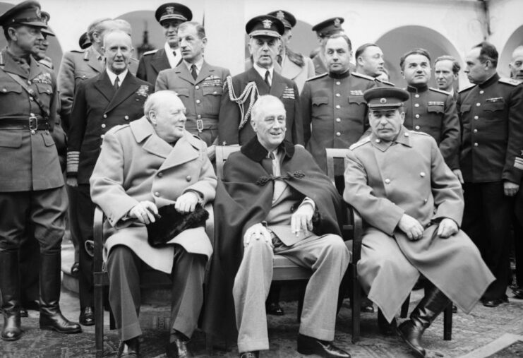 Winston Churchill, Franklin D. Roosevelt and Joseph Stalin surrounded by military personnel