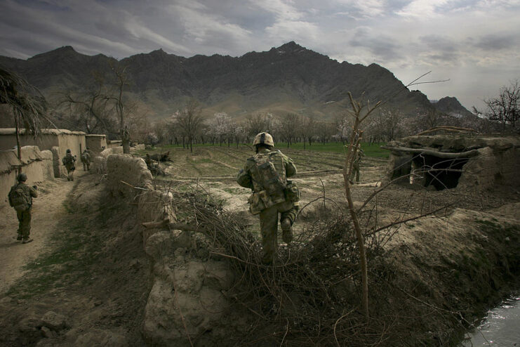 Australian soldiers walking through a town