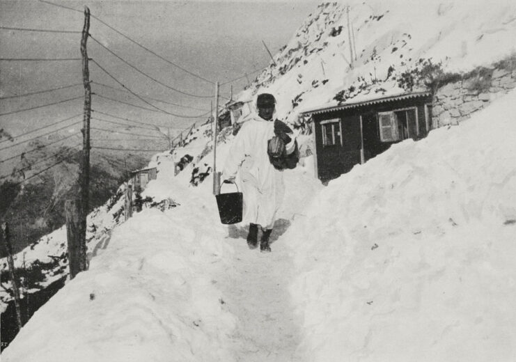 Soldier walking along a snow-covered path