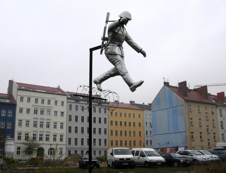 Statue of Conrad Schumann rising into the sky