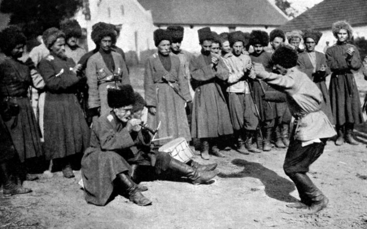 Russian Cossack dancing in front of his comrades