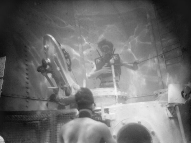 US Navy sailor testing a Davis Submerged Escape Apparatus in a water tank