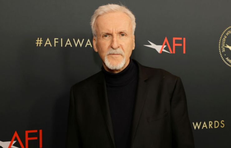 James Cameron standing on a red carpet