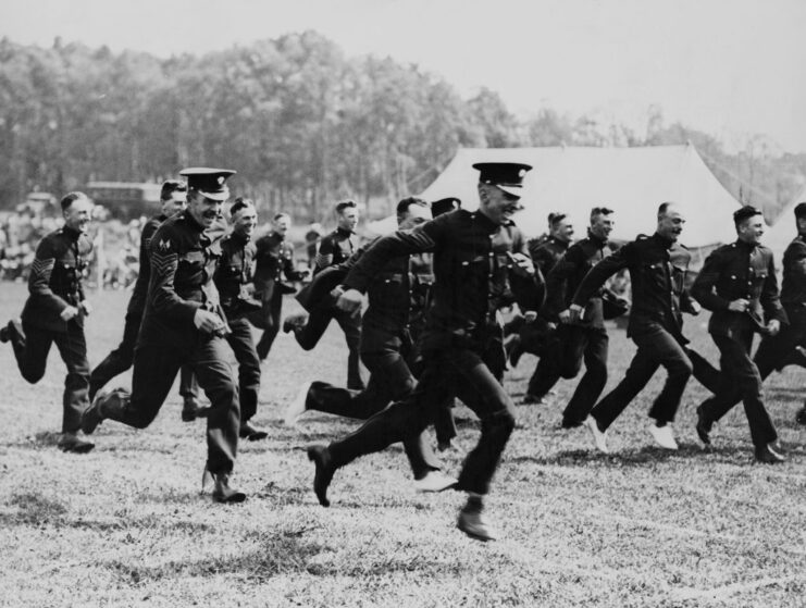 Grenadier Guards running across a field