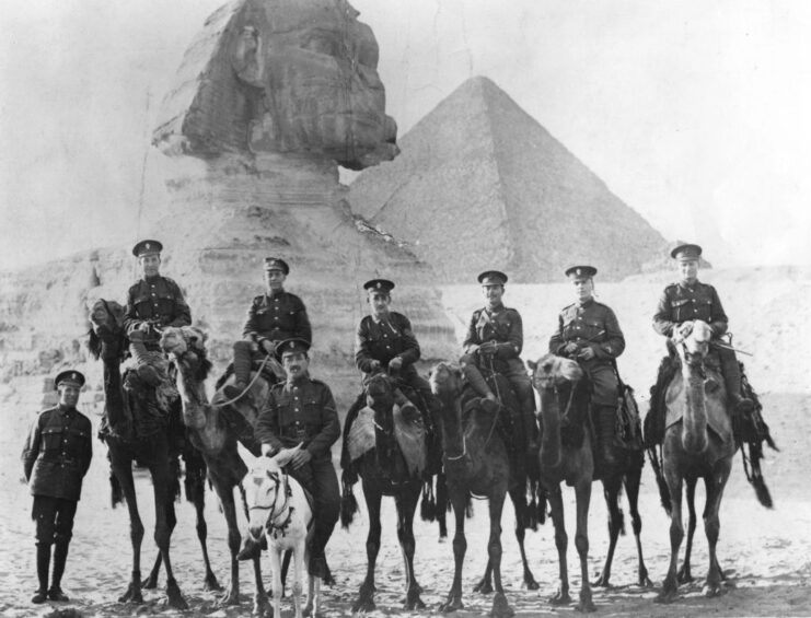 Jewish Legionnaires, on camels, posing in front of Ancient Egyptian landmarks