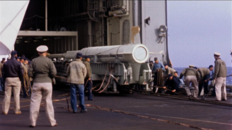 Crewmen standing around an X-17a ballistic missile on the deck of the USS Norton Sound (AV/AVM-11)