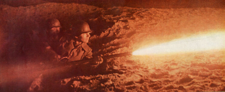 Two German soldiers firing a flamethrower