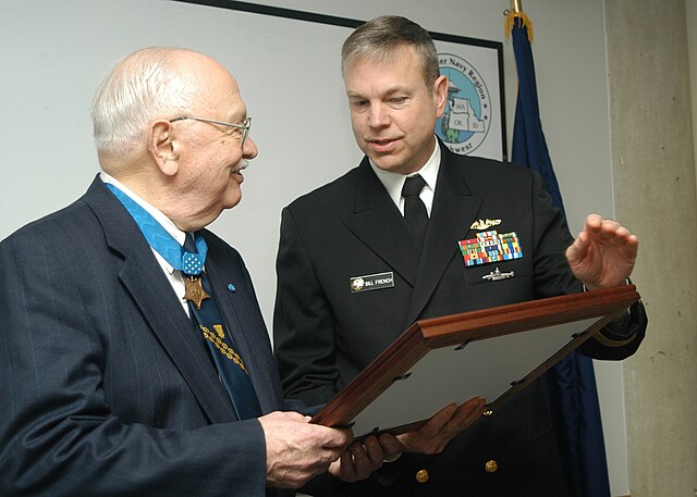 William French presenting a framed photograph to Richard M. McCool, Jr.