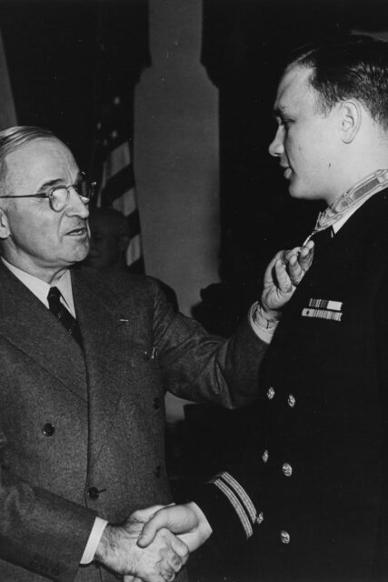 Harry S. Truman shaking Richard M. McCool, Jr.'s hand