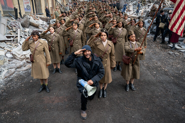 Tyler Perry standing with the cast of 'The Six Triple Eight'