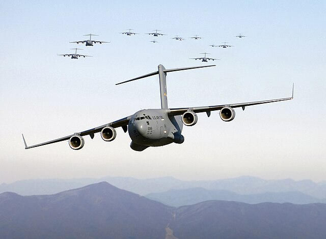 Thirteen Boeing C-17 Globemaster IIIs in flight