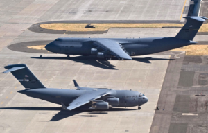 Lockheed C-5 Galaxy and Boeing C-17 Globemaster III parked on the tarmac