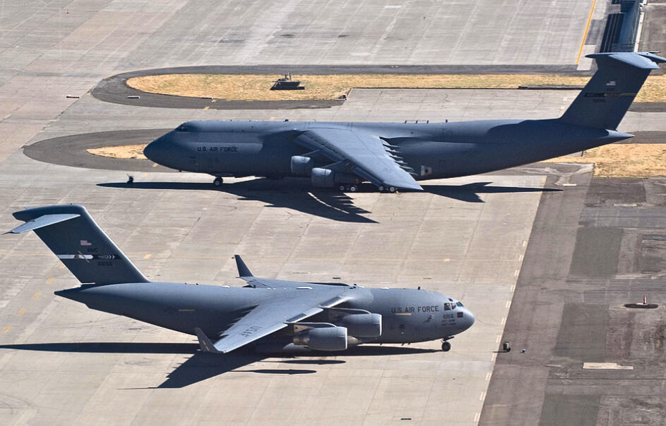 Lockheed C-5 Galaxy and Boeing C-17 Globemaster III parked on the tarmac